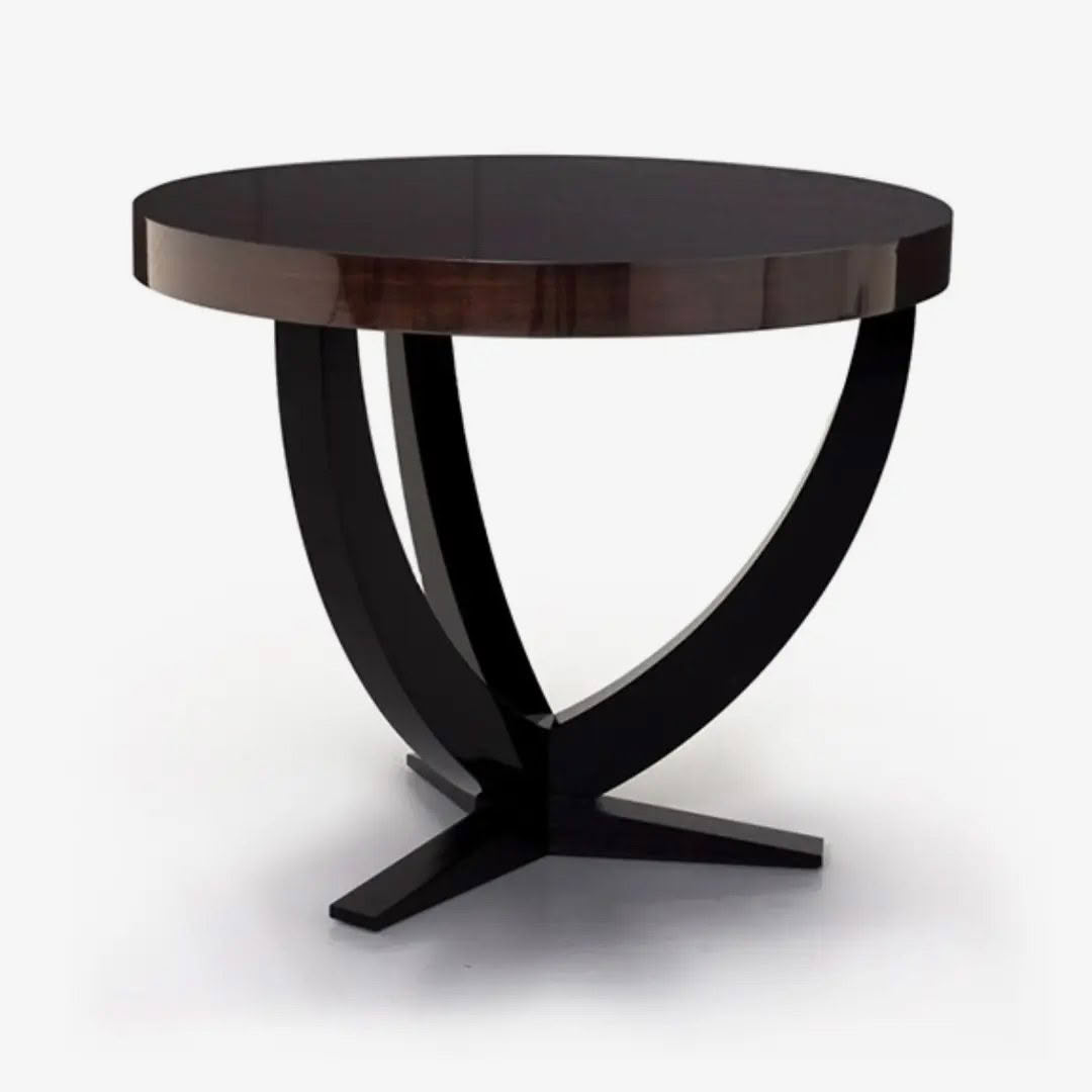 Mayfair-Lamp-Table_1.webp Round wooden table with black curved legs