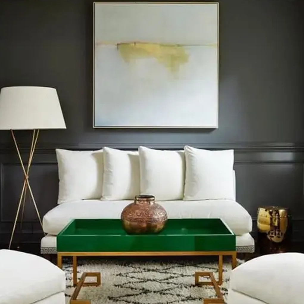 Elegant living room with green coffee table and art