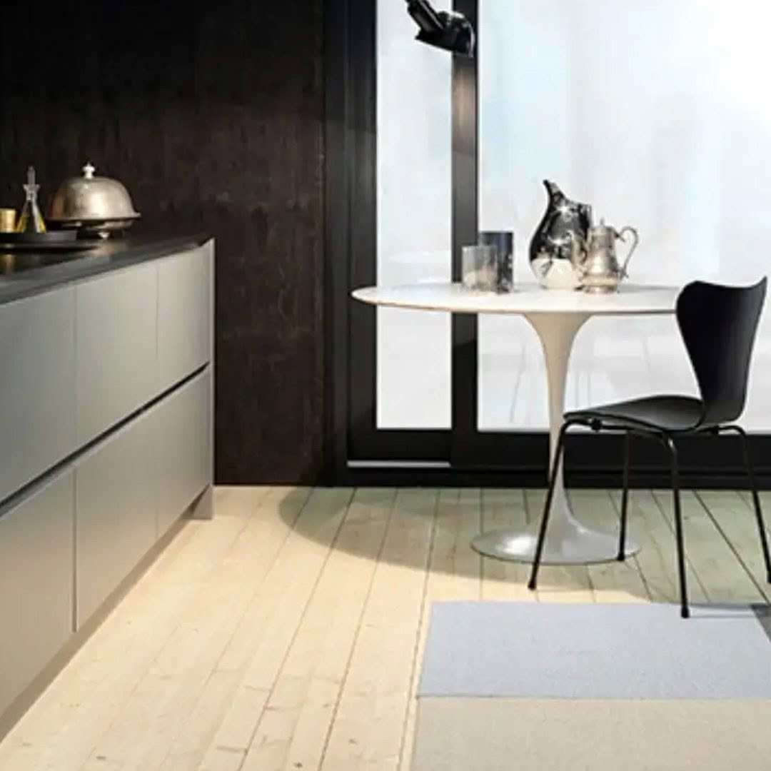 wd3 Modern kitchen with marble table and sleek cabinetry