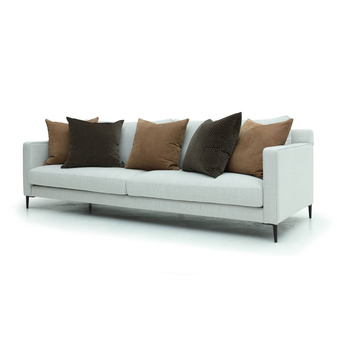 Modern gray sofa with brown and black pillows