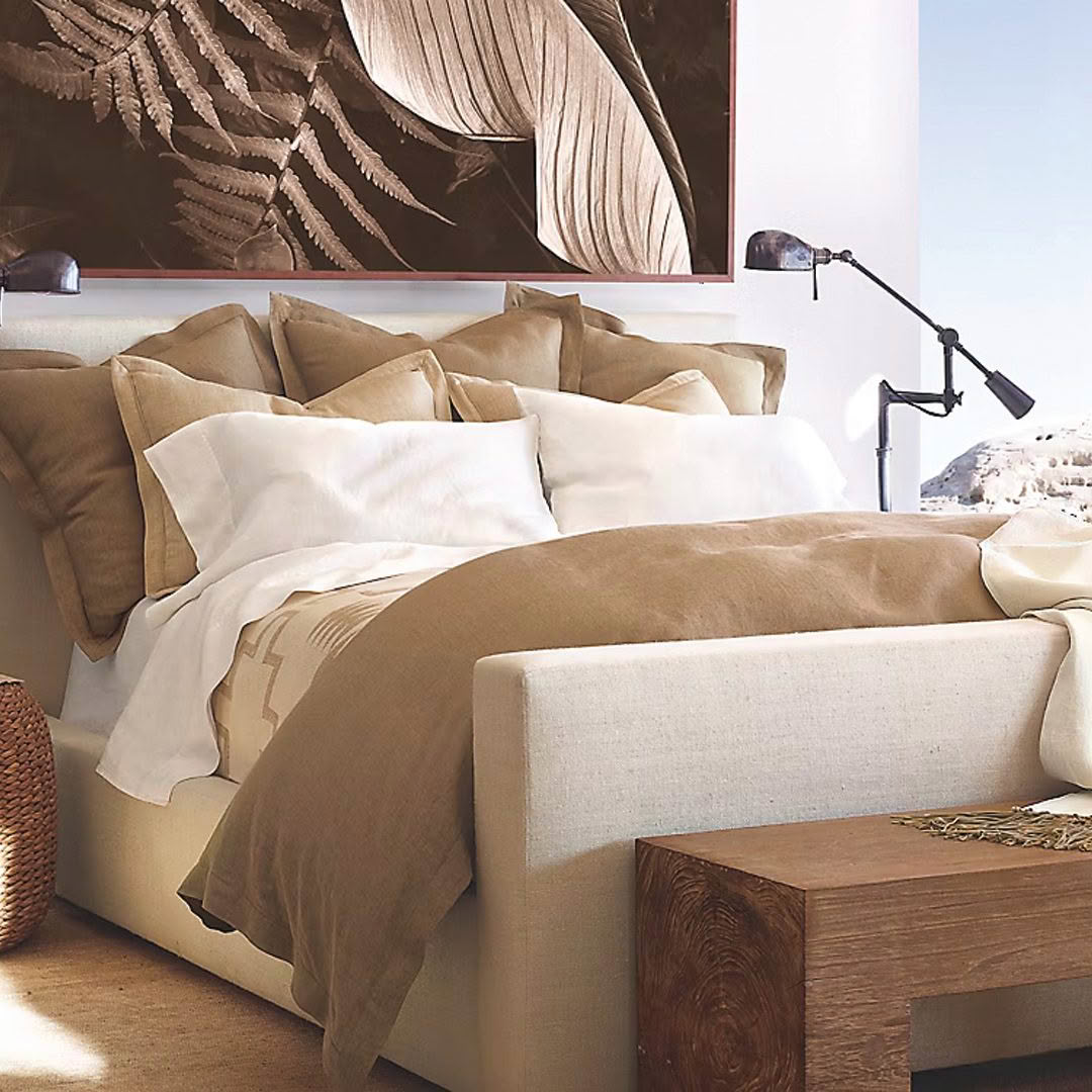 Elegant bedroom with beige bedding and modern decor