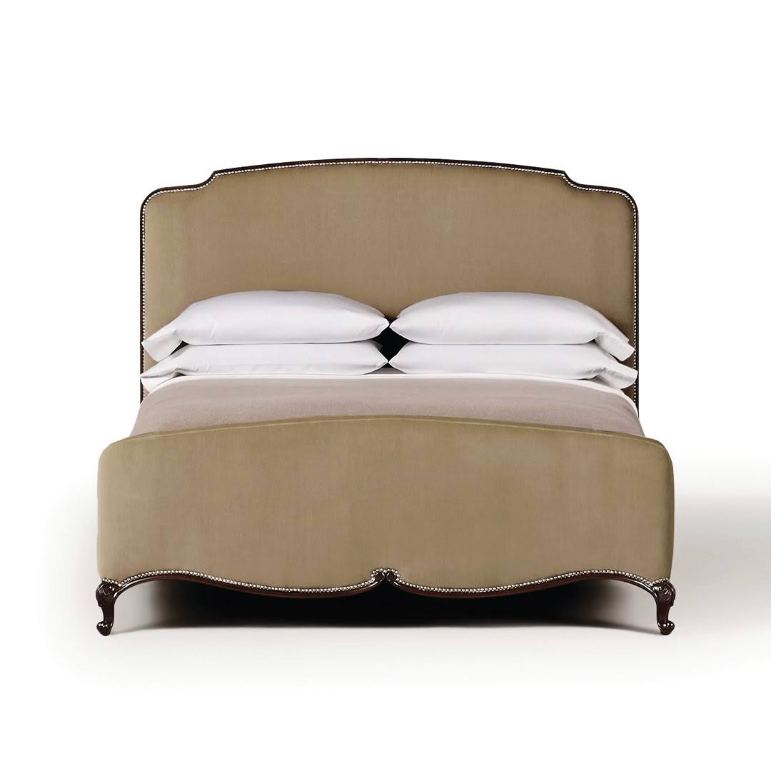 Elegant olive upholstered bed with white bedding