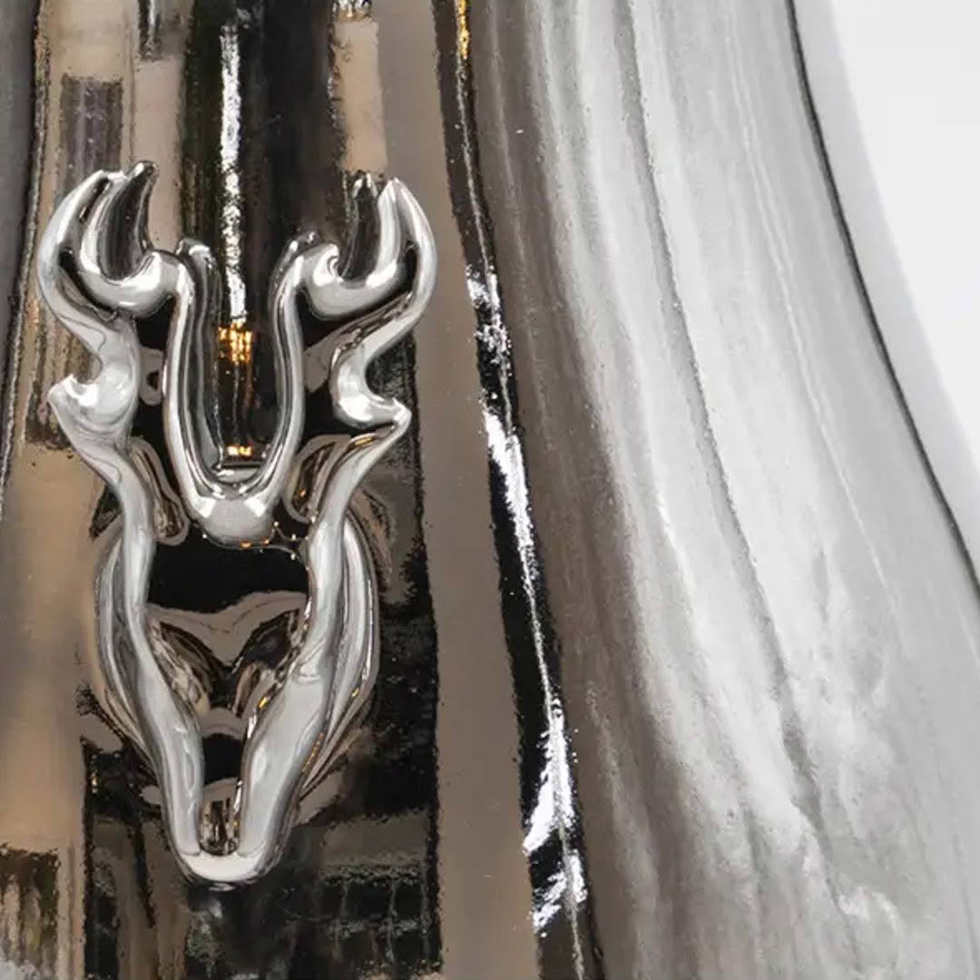 Close-up of shiny silver deer ornament