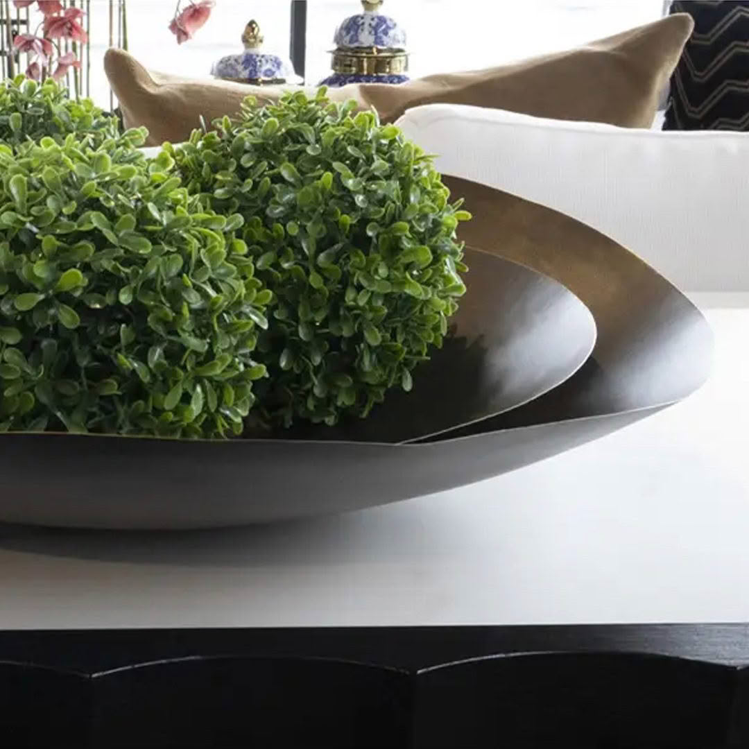 Elegant decorative bowl with lush green plants