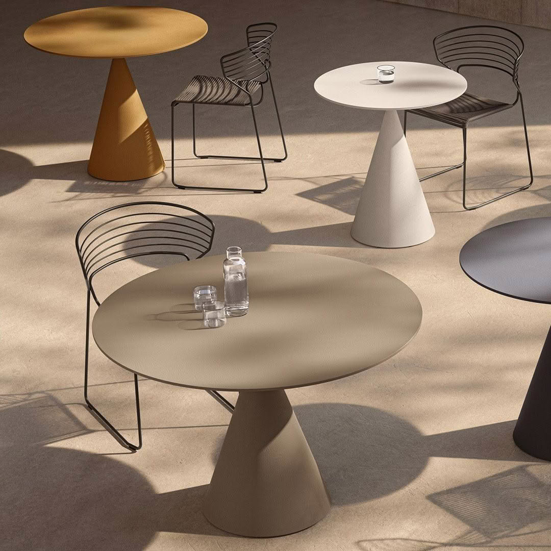 Stylish outdoor furniture setup with modern tables and chairs