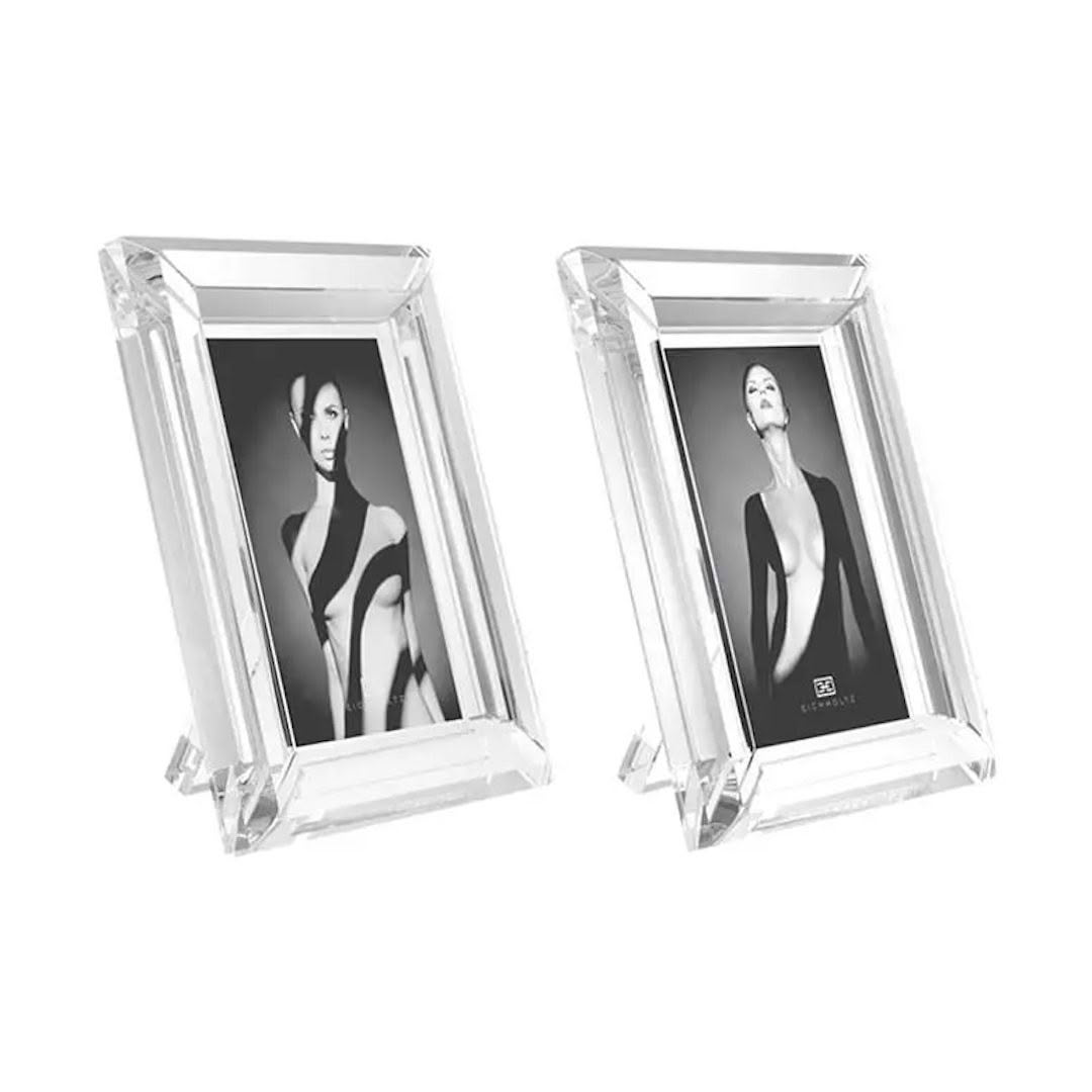 Two acrylic frames displaying black-and-white portrait photos