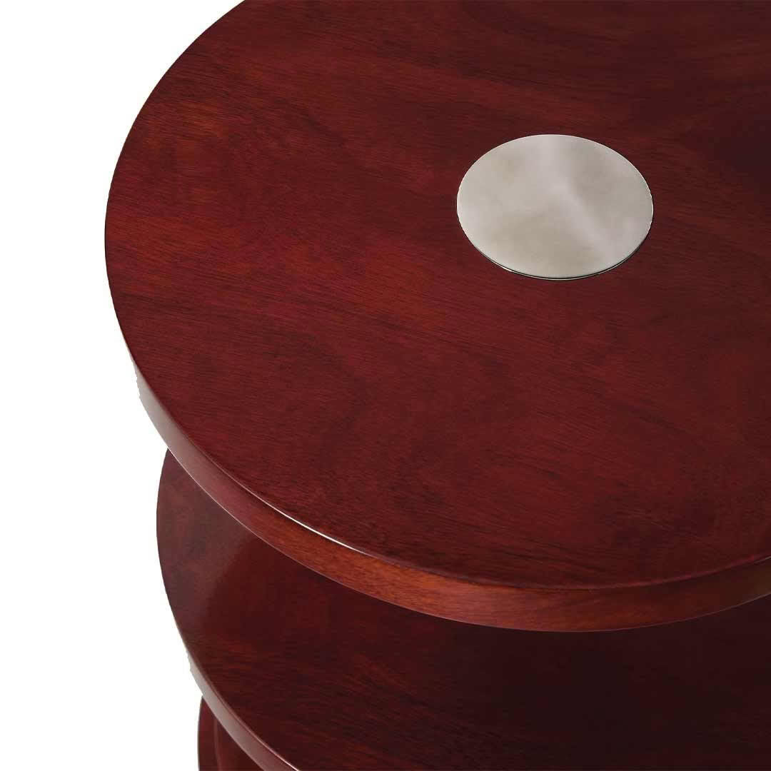 Round mahogany side table with inlaid silver circle