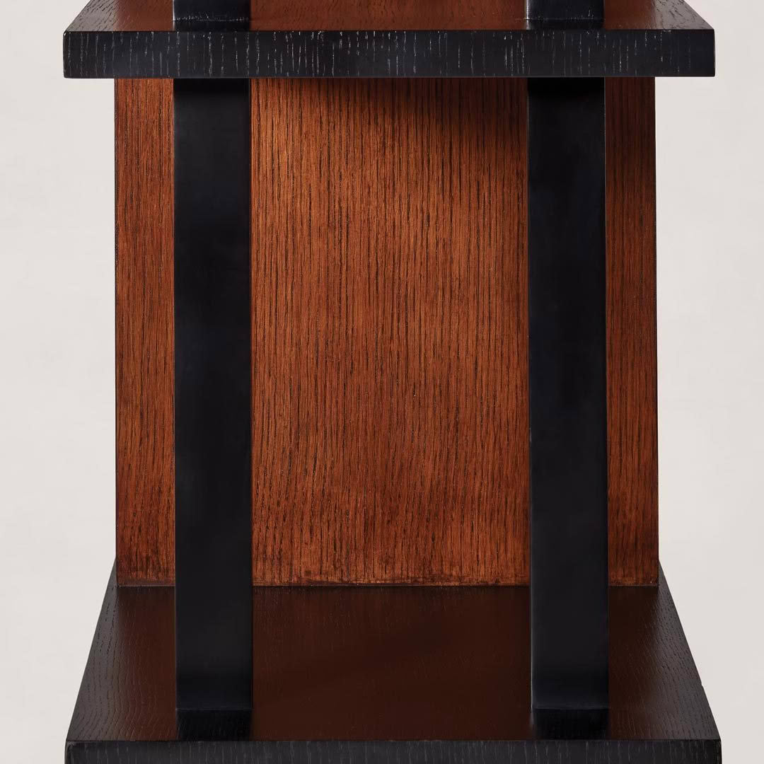 Close-up of a wooden podium with black accents