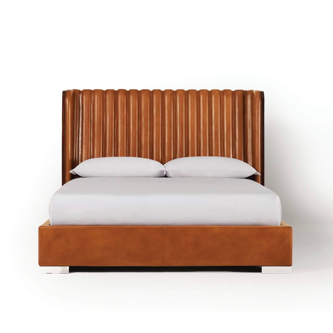 Modern brown leather bed with white bedding