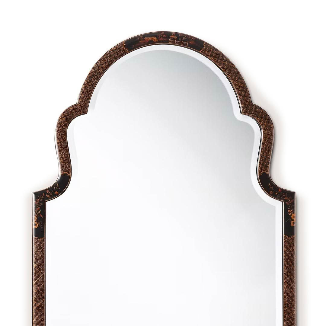 Elegant arched mirror with ornate brown frame