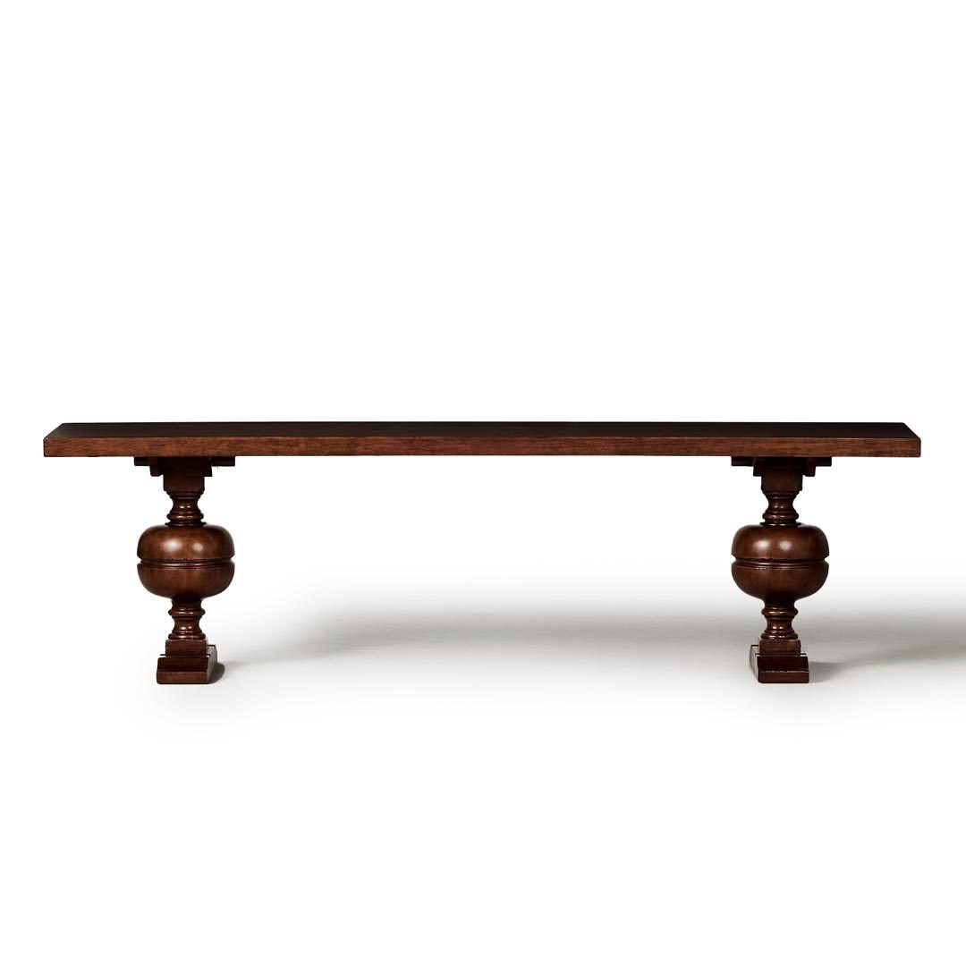 Antique wooden table with ornate legs