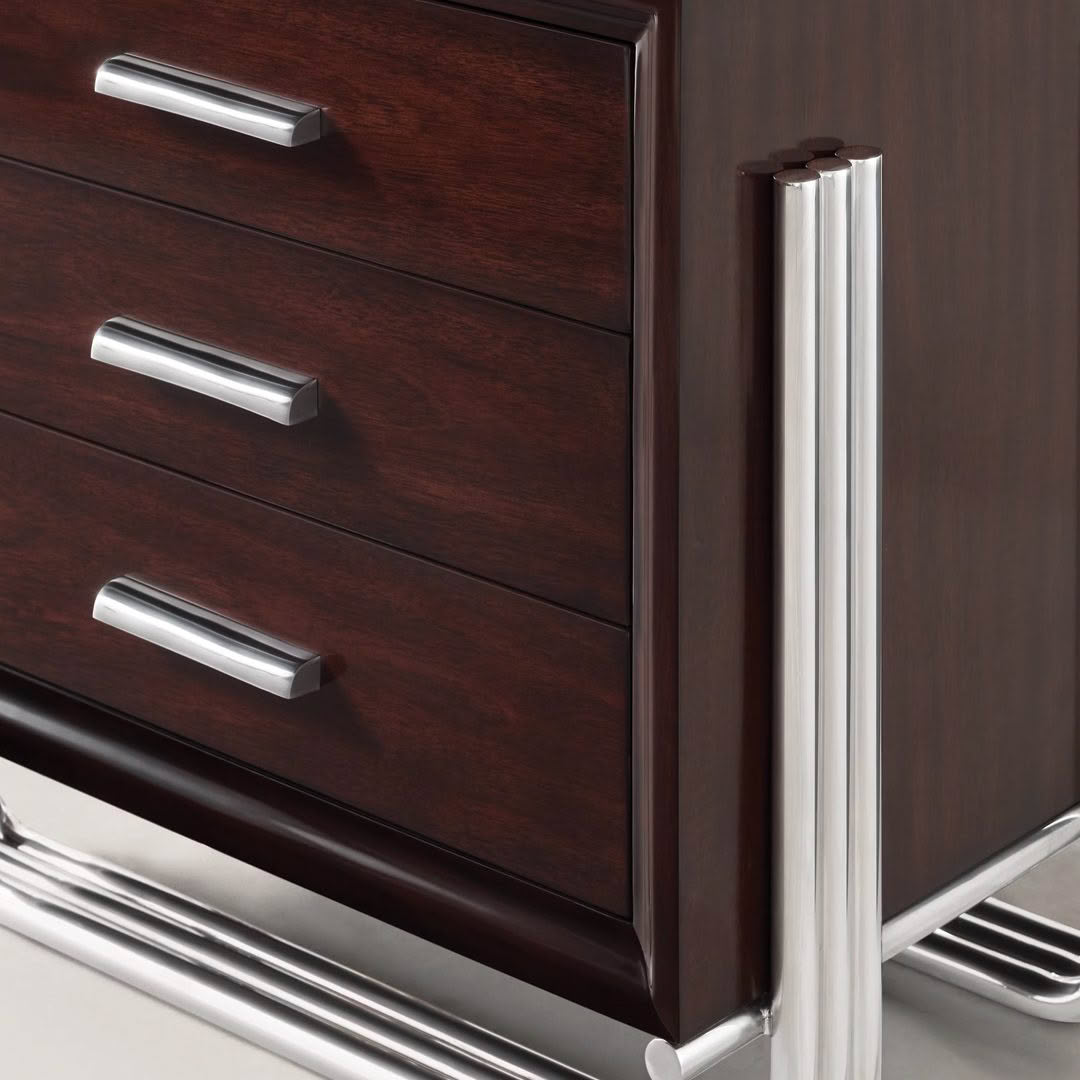 Close-up of modern dark wooden drawer with metal handles