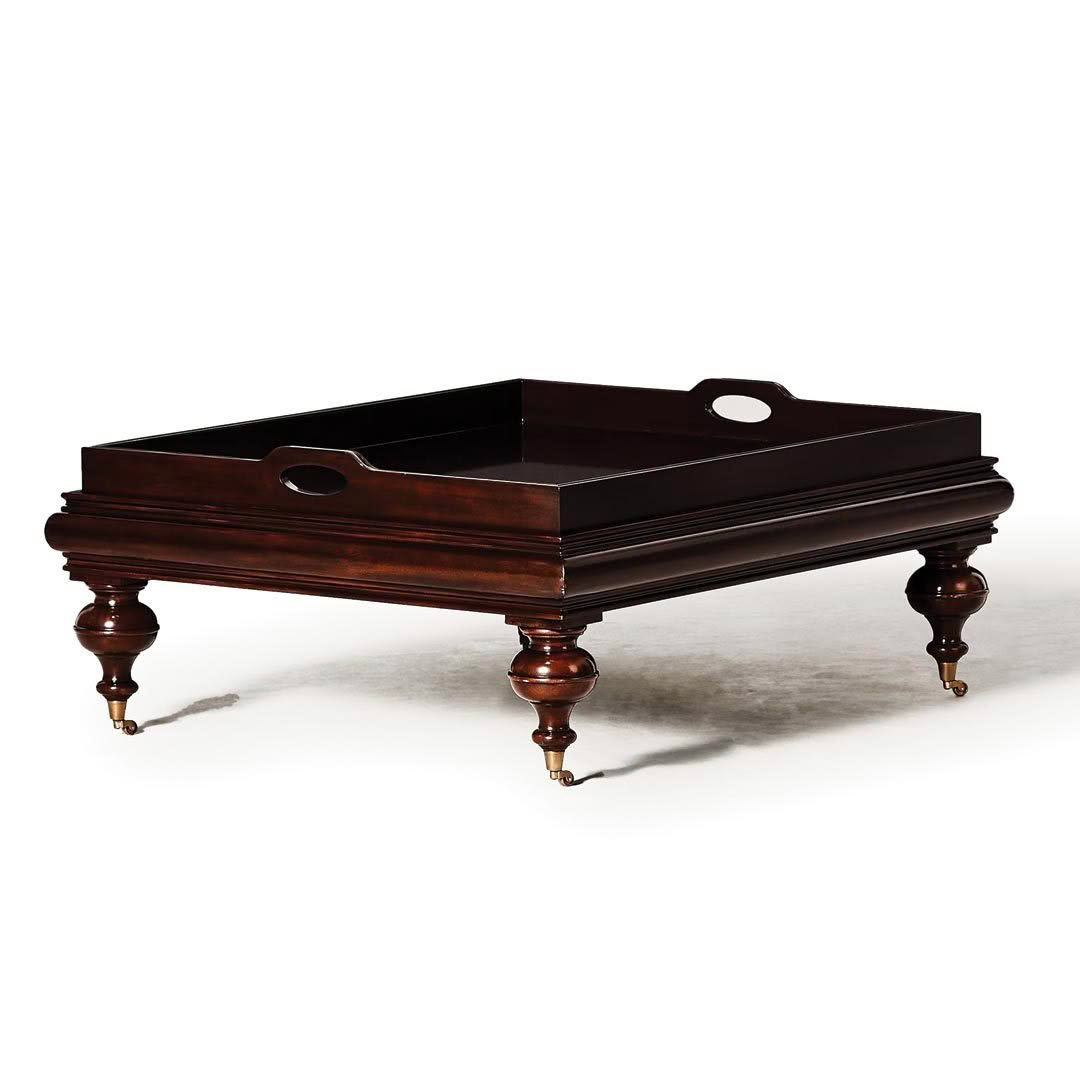 Antique wooden serving tray on elegant legs