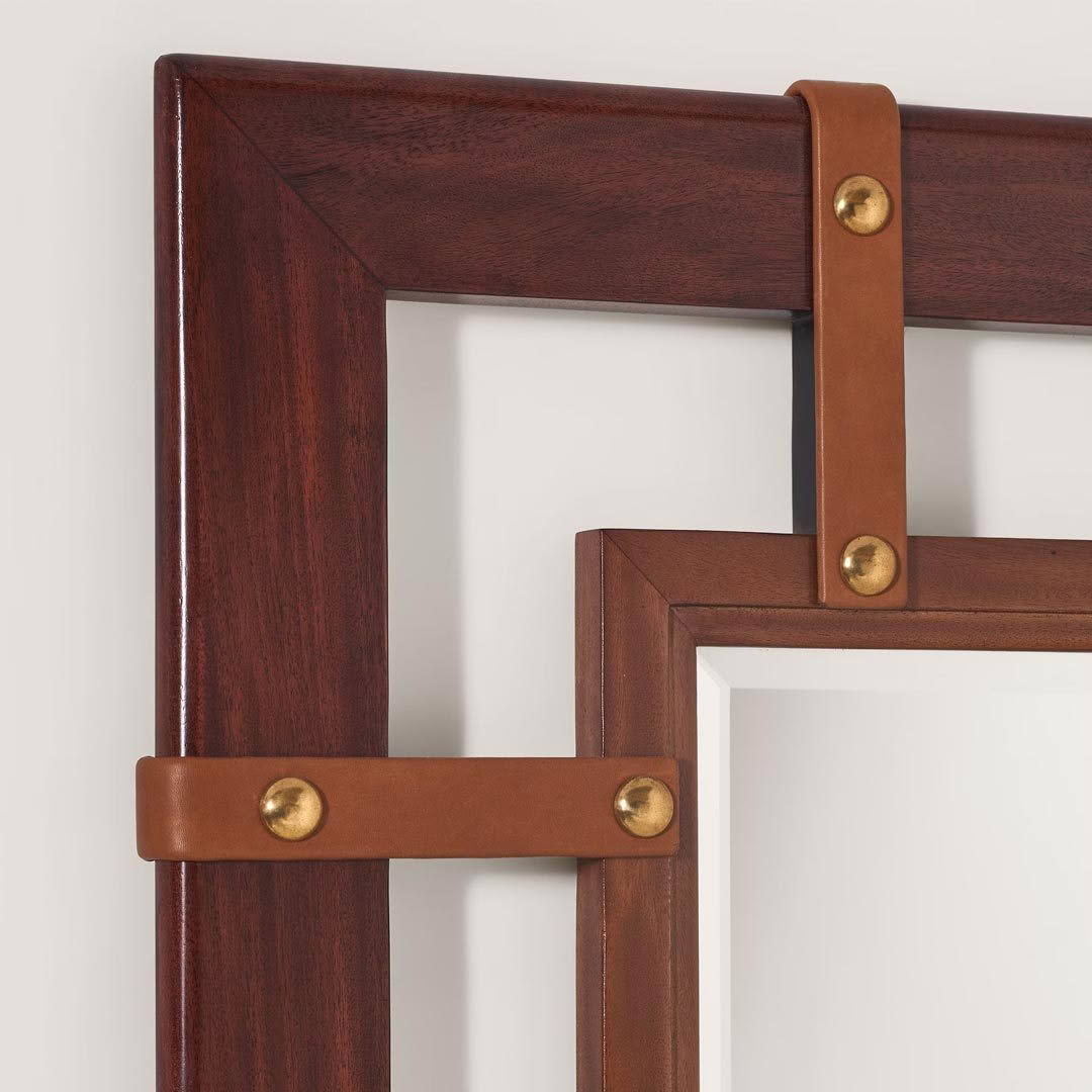 Close-up of wooden frame with leather straps and brass rivets