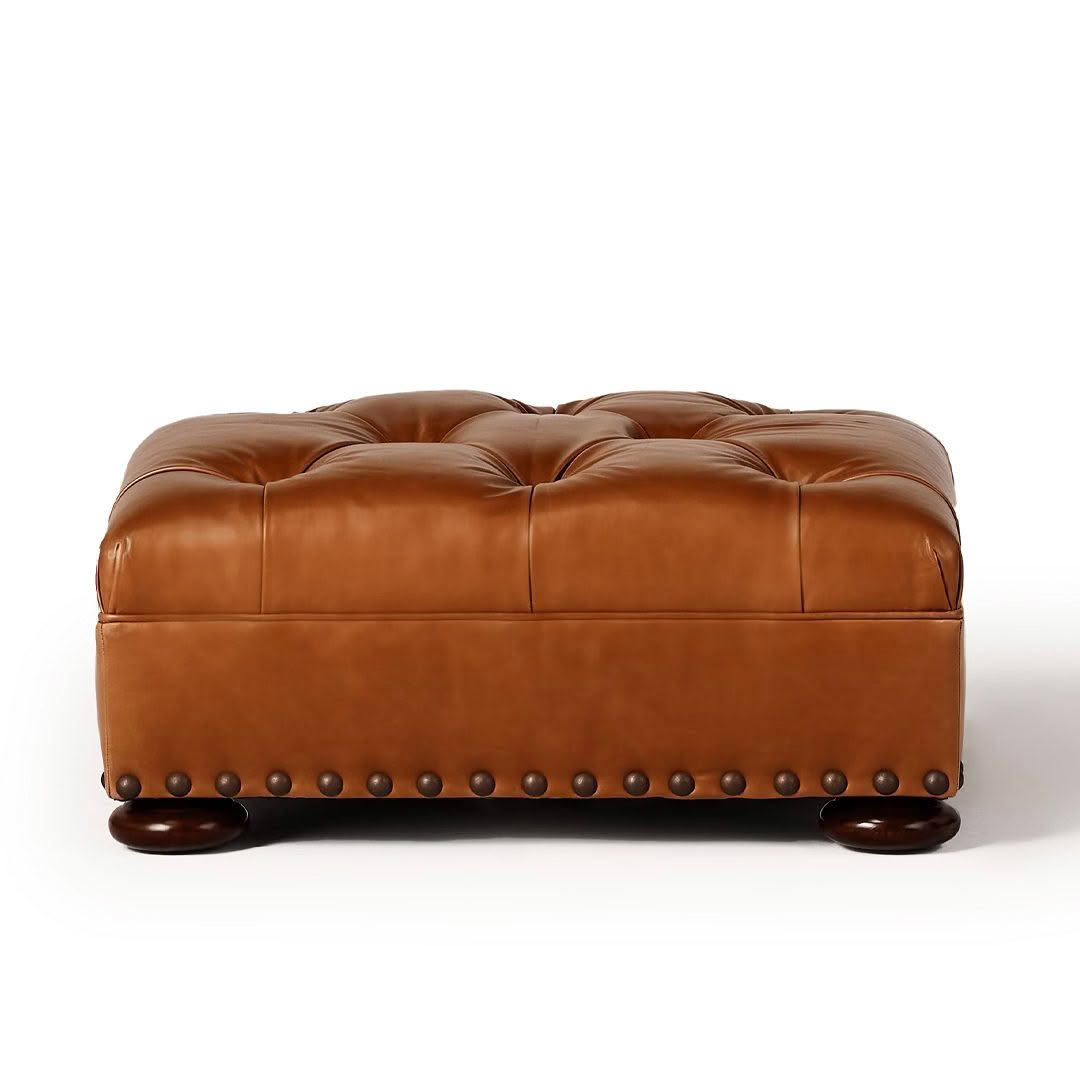 Brown leather tufted ottoman with wooden legs