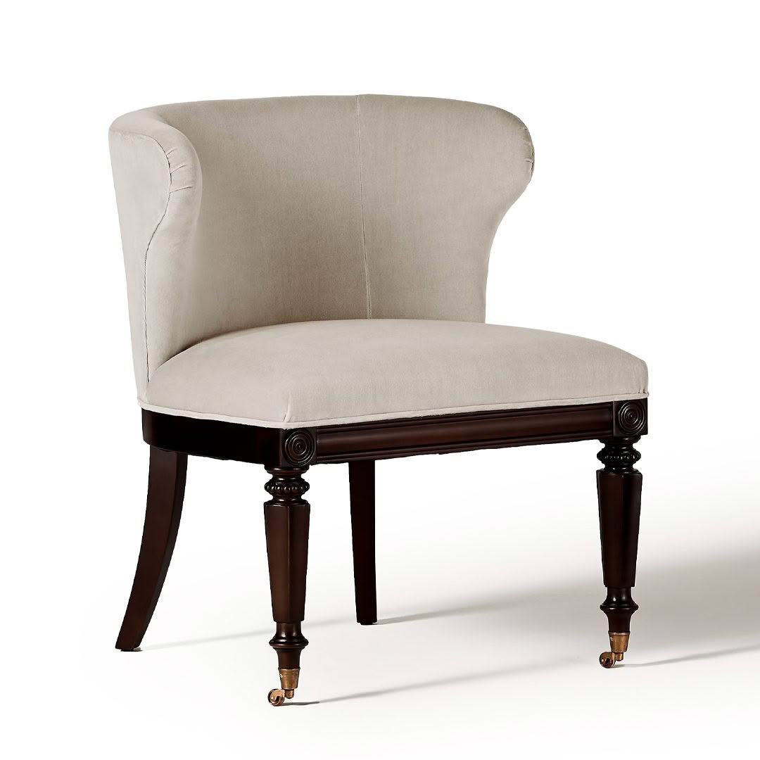 Elegant beige upholstered chair with dark wooden legs