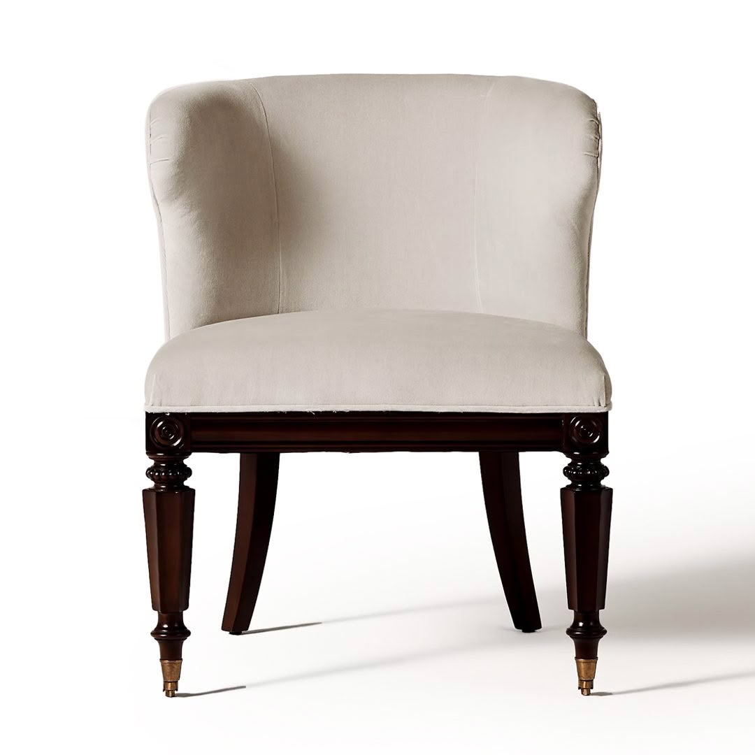 Elegant cream upholstered chair with dark wooden legs