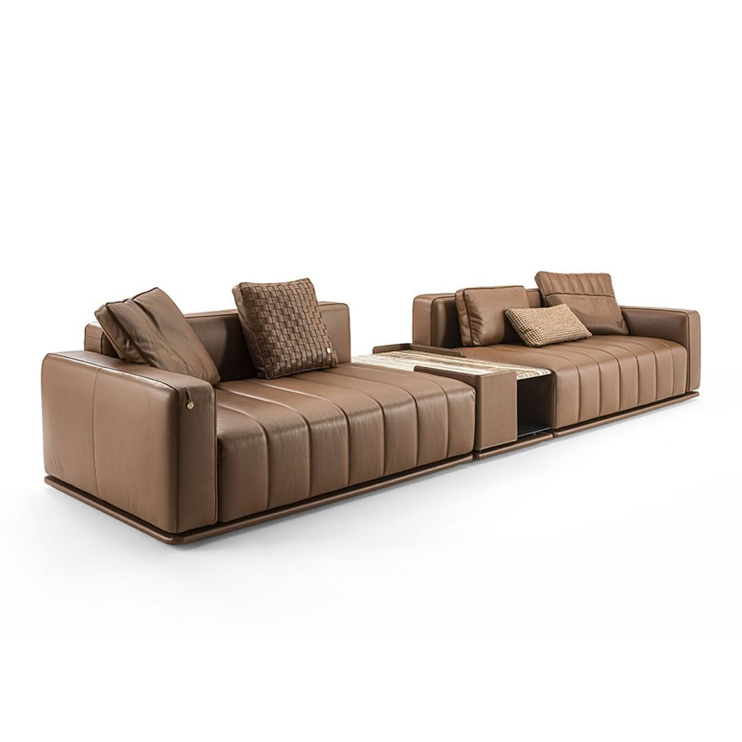 Modern brown leather sectional sofa with pillows