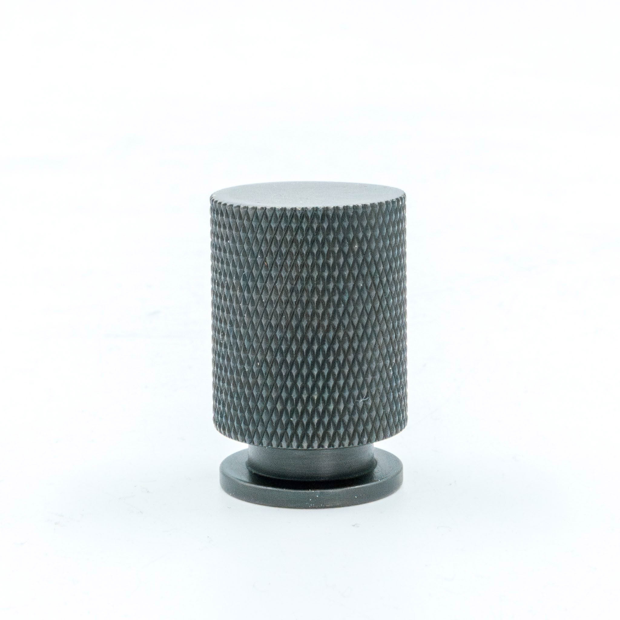 Black textured cylindrical object on white background