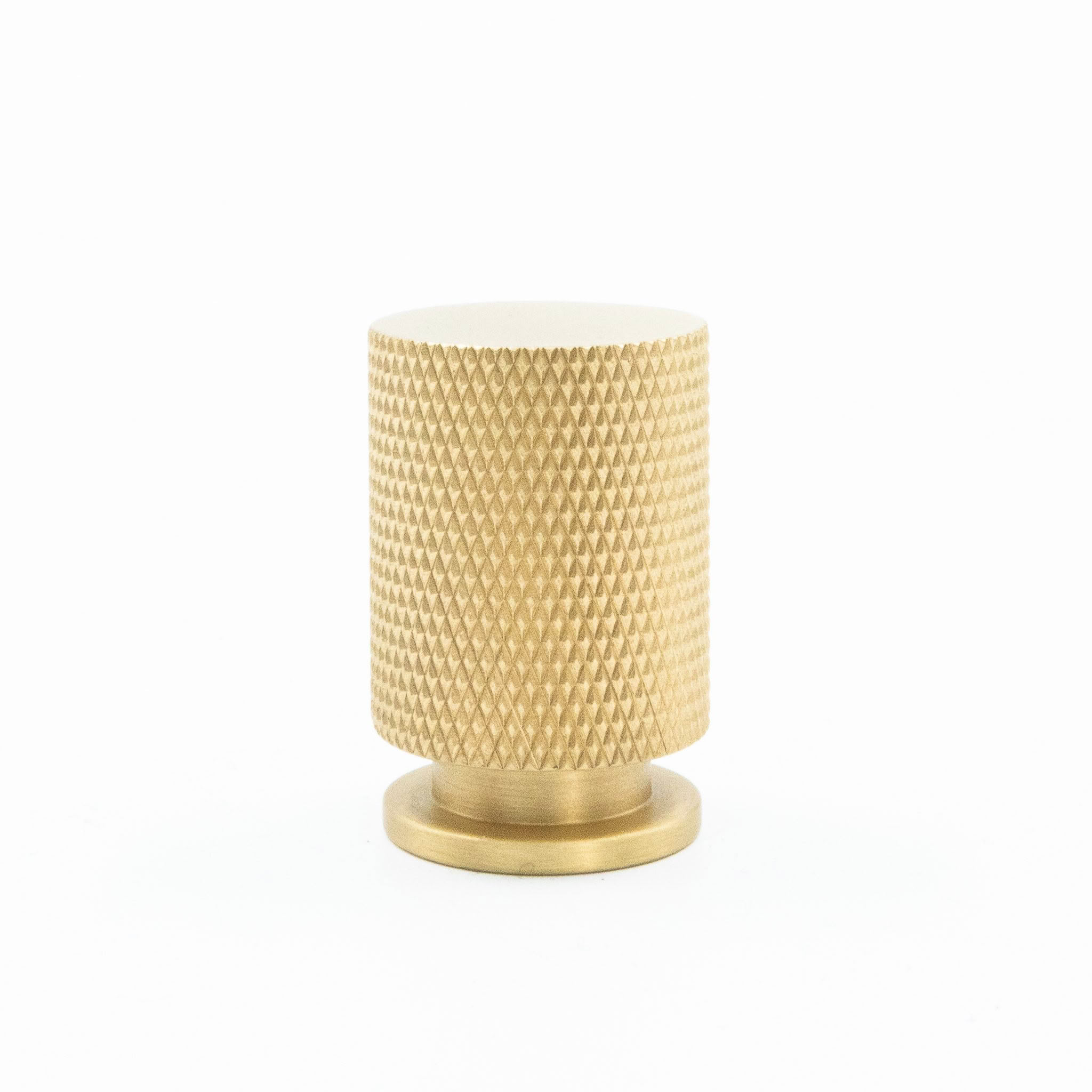 Golden textured small candle holder on white background