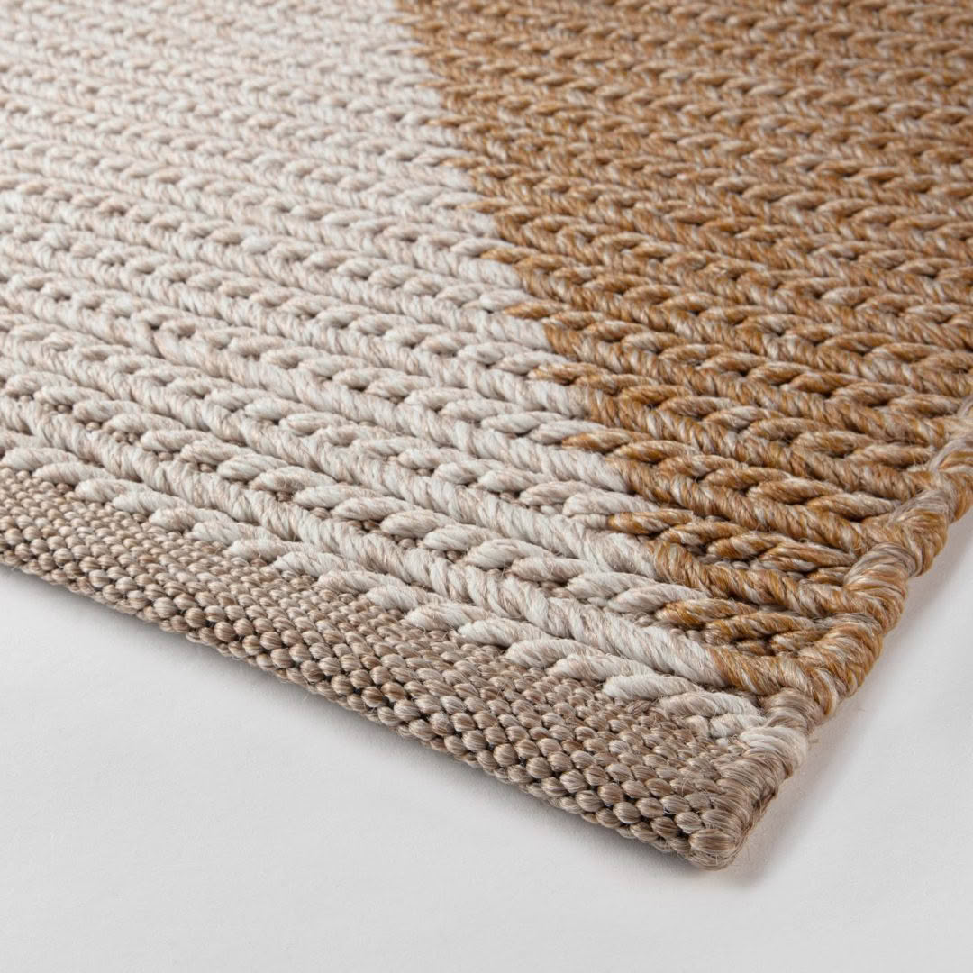 Close-up of textured woven natural fiber rug