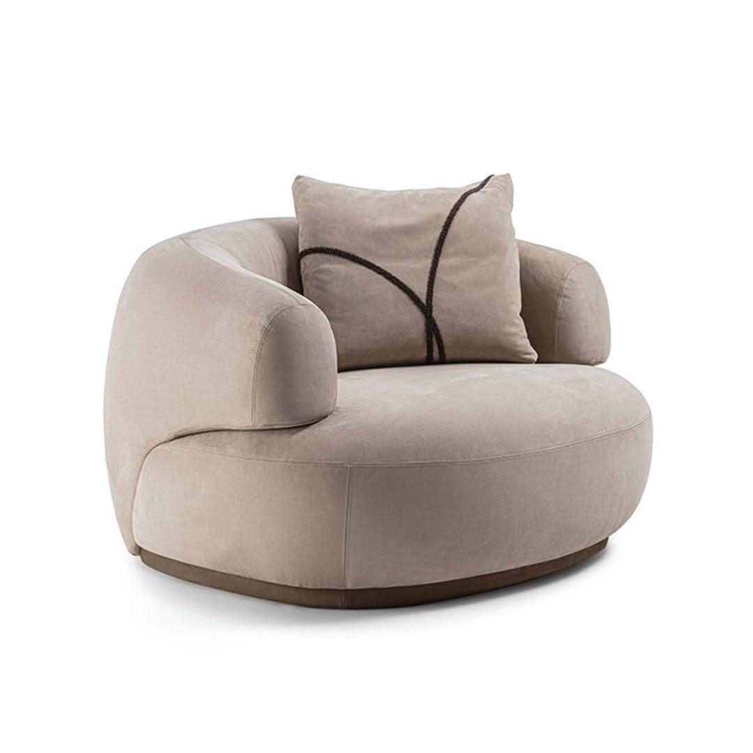 Beige modern armchair with decorative pillow