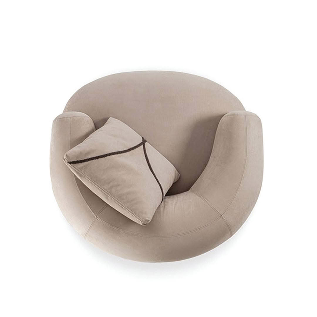 Round beige armchair with pillow, isolated on white