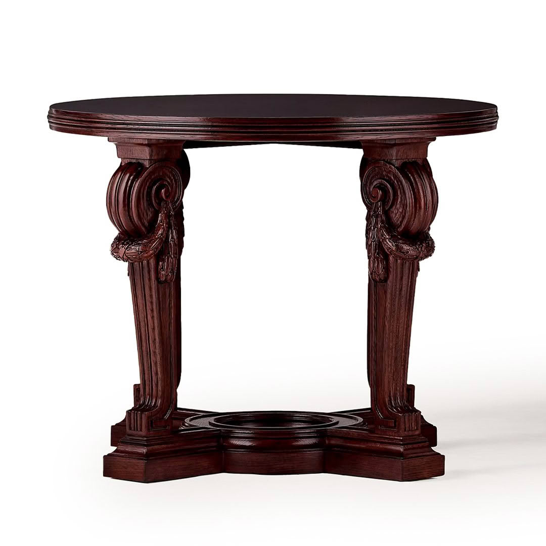 Ornate carved wooden circular table on white background