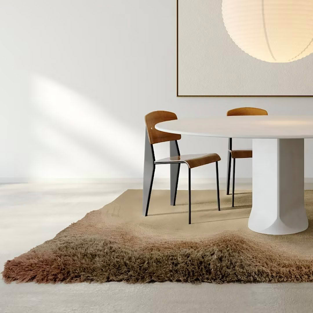 Modern minimalist dining room with oval table and chairs