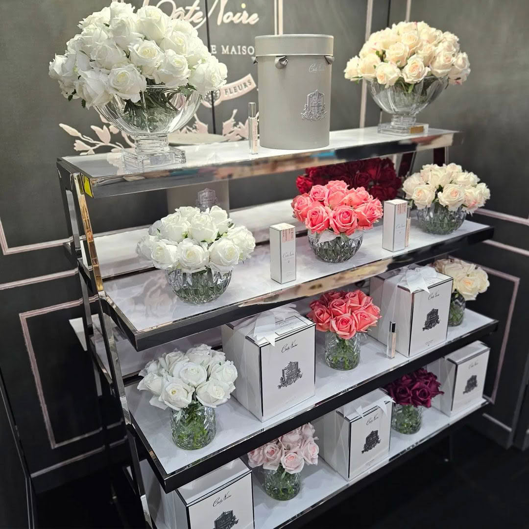 Elegant display of roses and products in floral shop