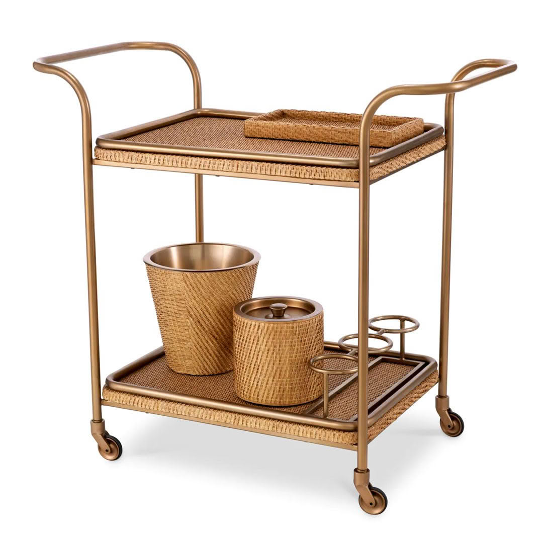 Elegant gold bar cart with woven baskets and towels