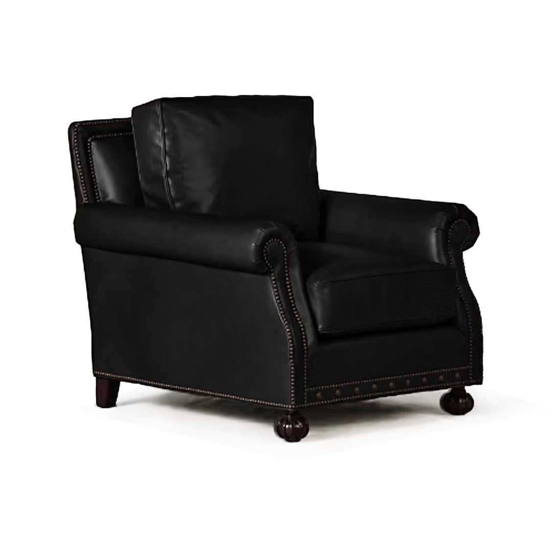 Black leather armchair with nailhead trim