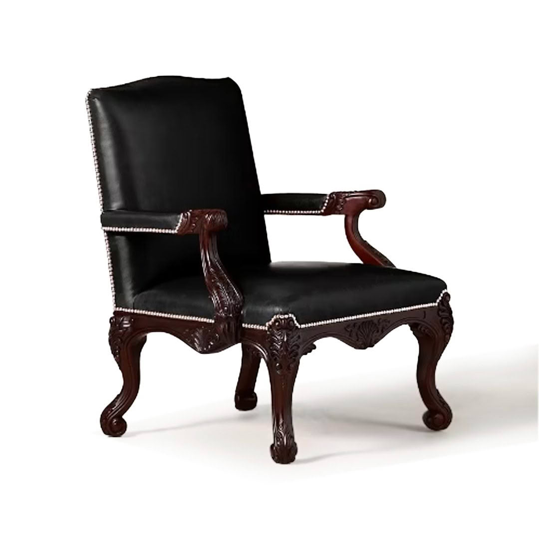 Elegant black leather chair with carved wooden legs