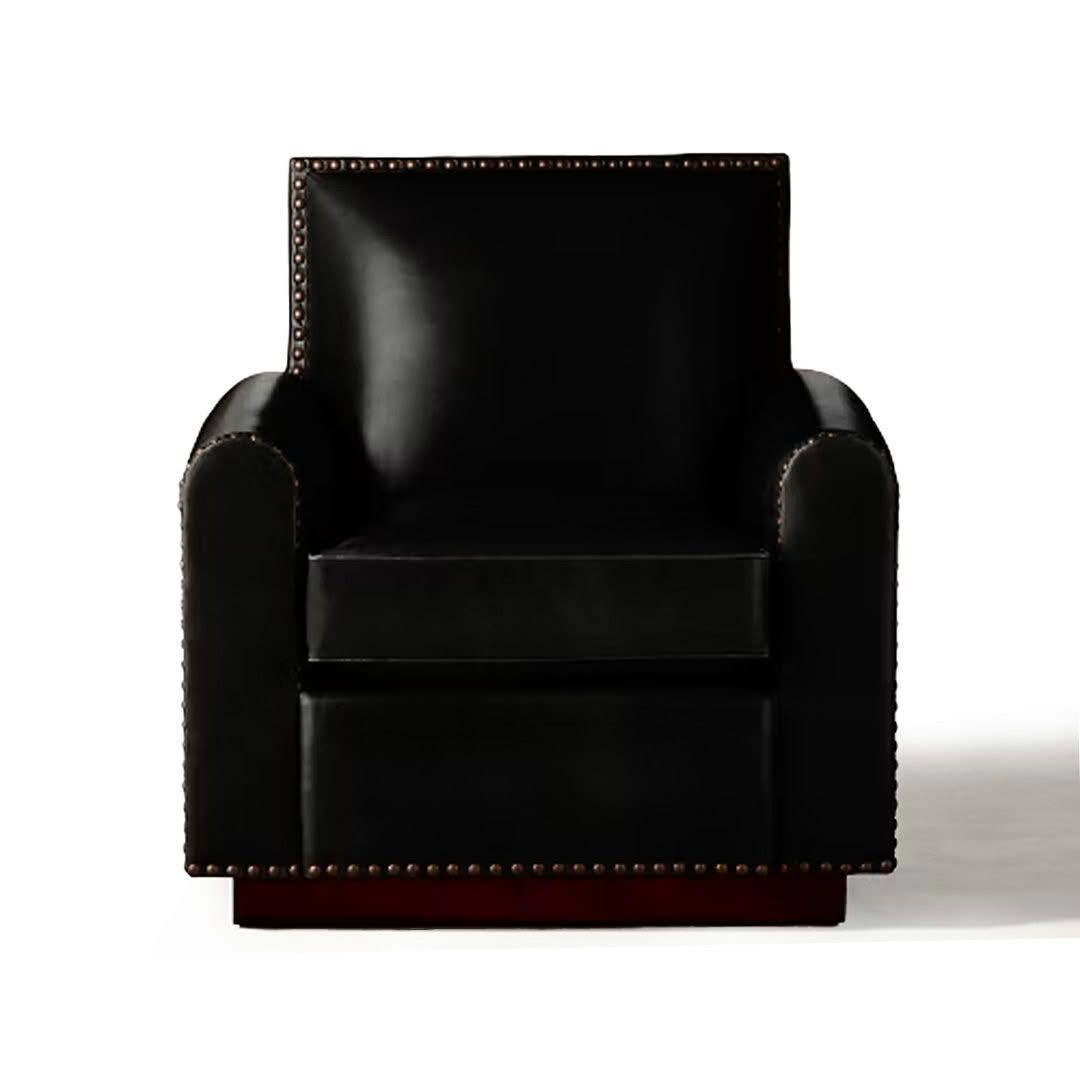 Elegant black leather armchair with brass nailhead trim