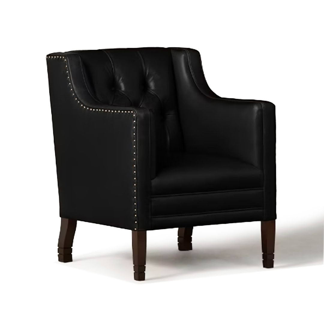 Elegant black leather armchair with brass nailhead trim