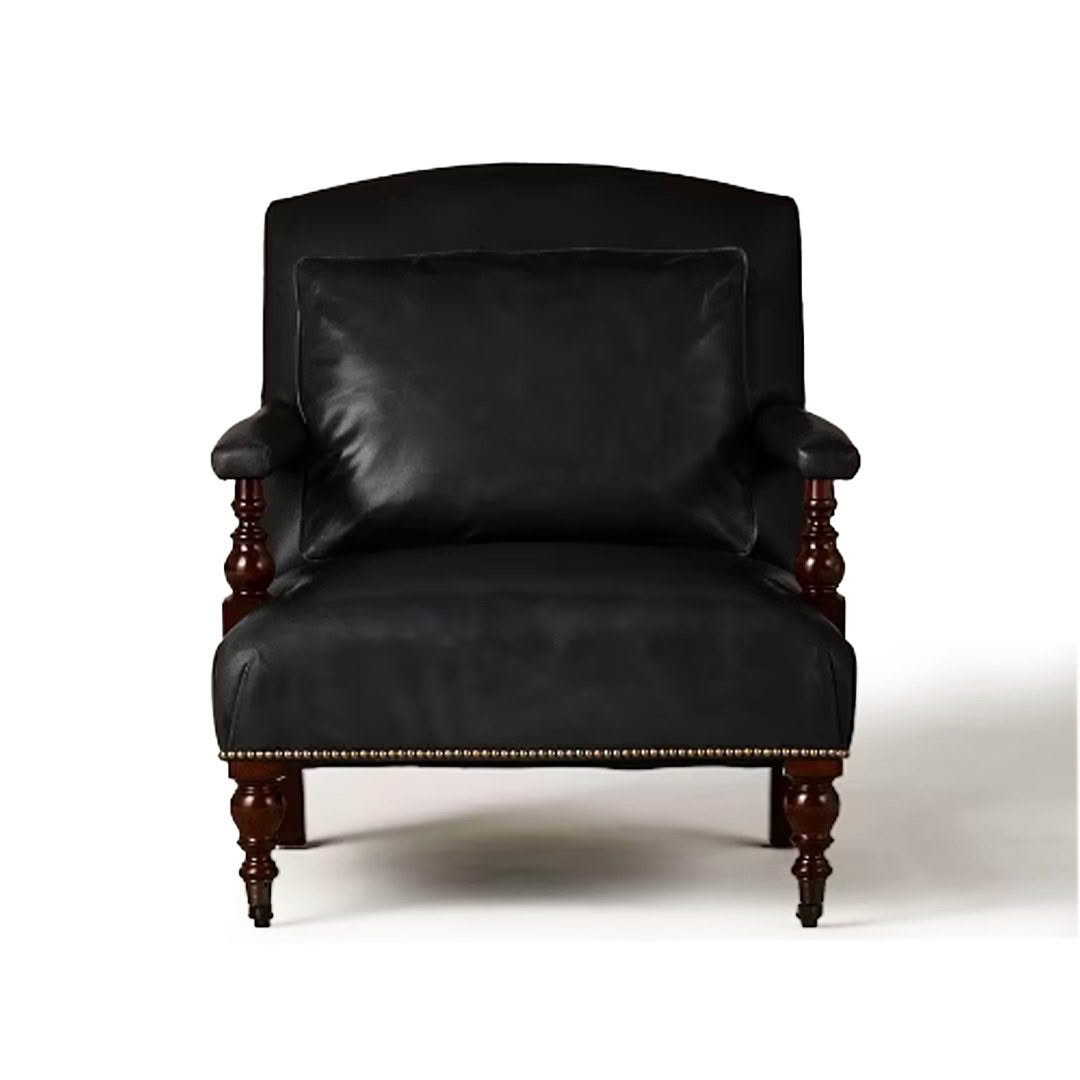 Elegant black leather armchair with wooden legs