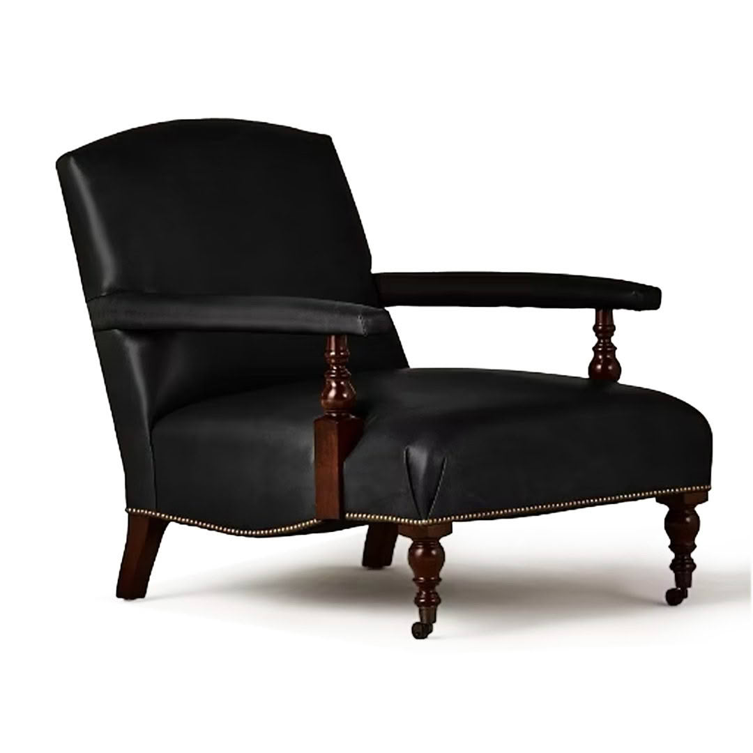 Elegant black leather armchair with wooden legs