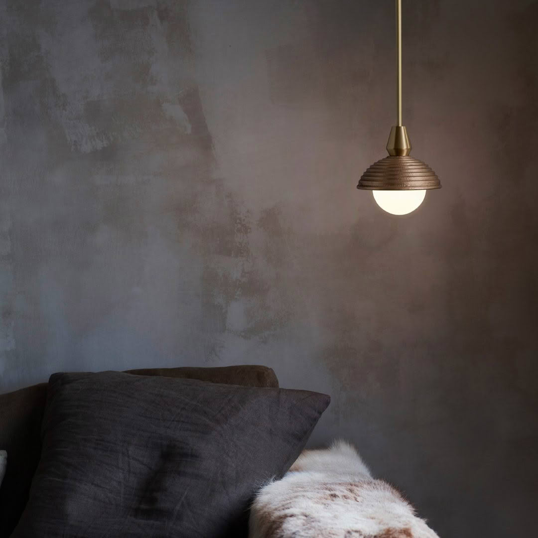Modern lamp over cozy sofa corner