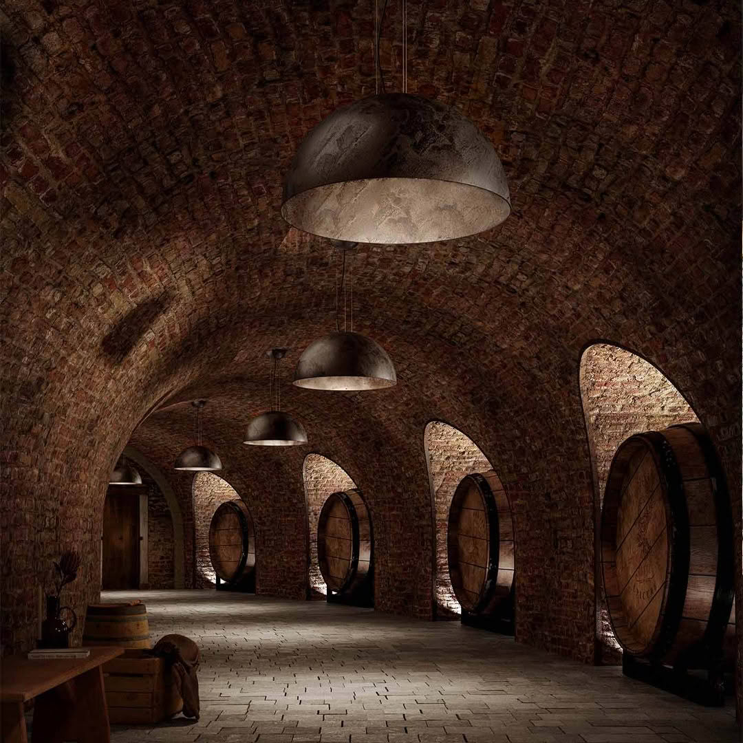 Vintage wine cellar with arched ceilings and large barrels