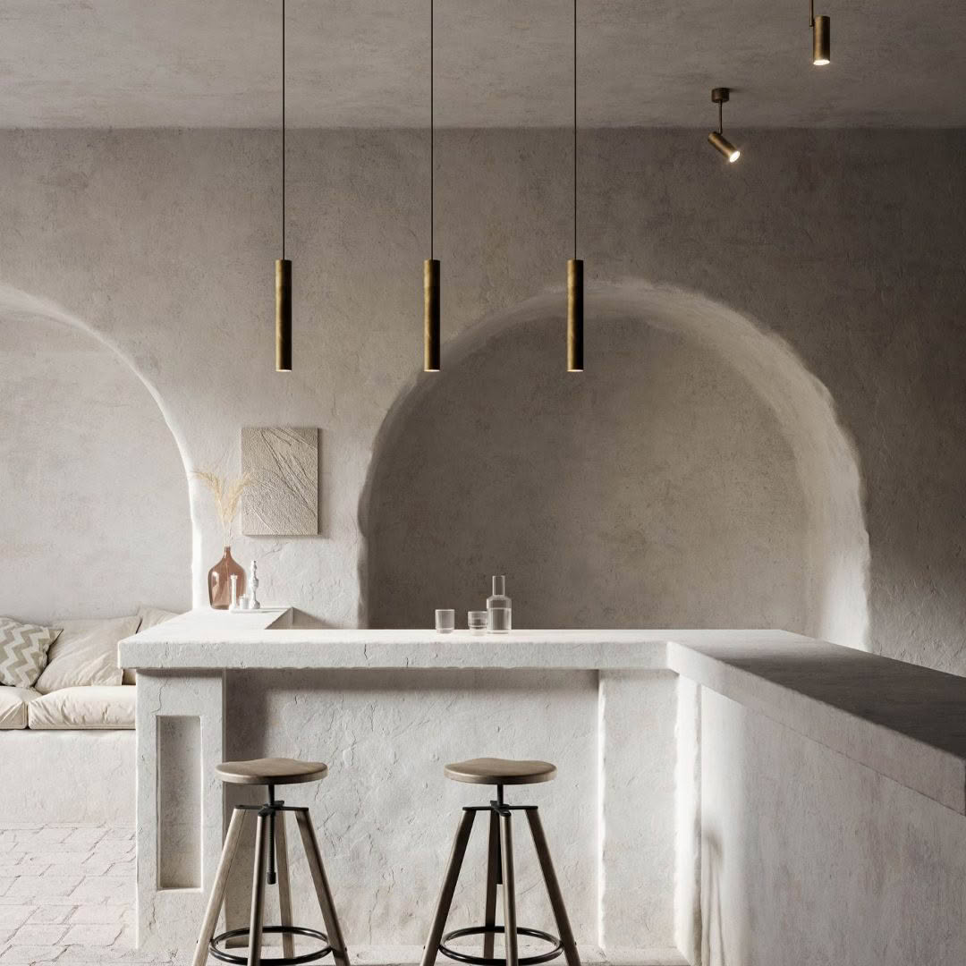 Minimalist kitchen with pendant lights and bar stools