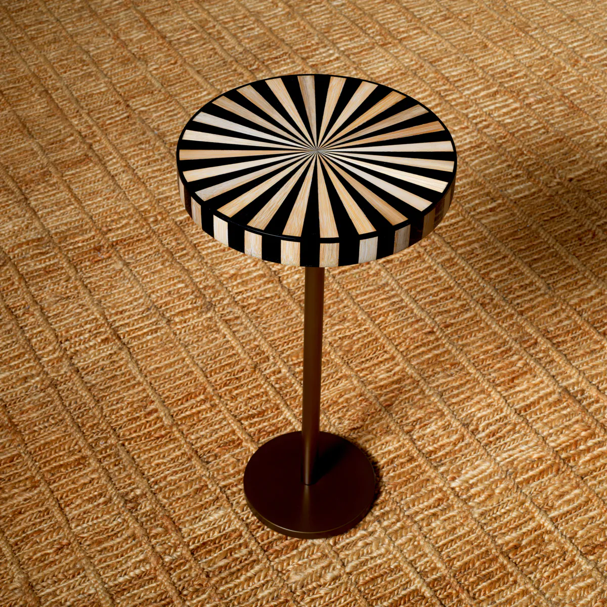 Modern striped round side table on textured carpet
