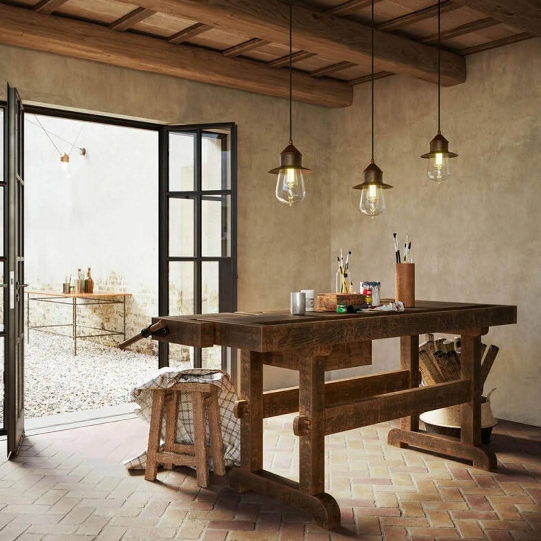 Rustic studio with wooden table and hanging lights