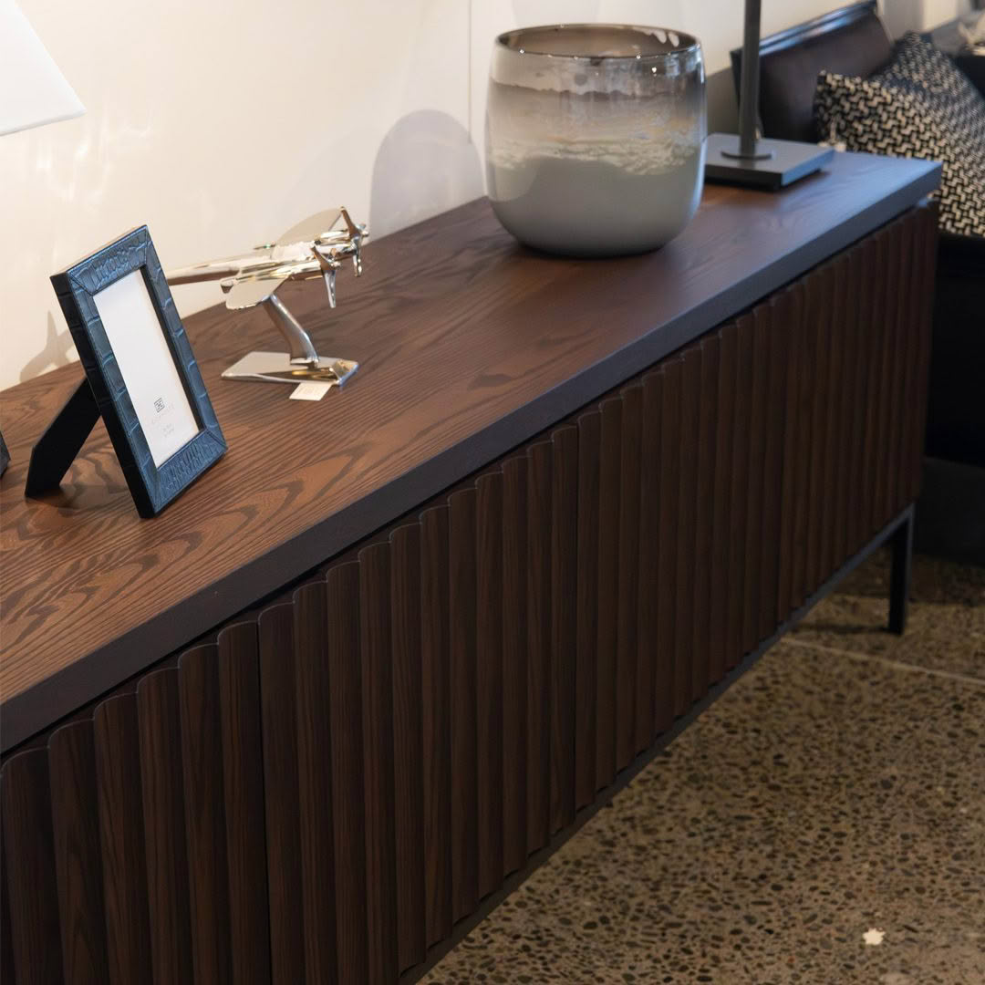 Modern office reception with decorative items on cabinet