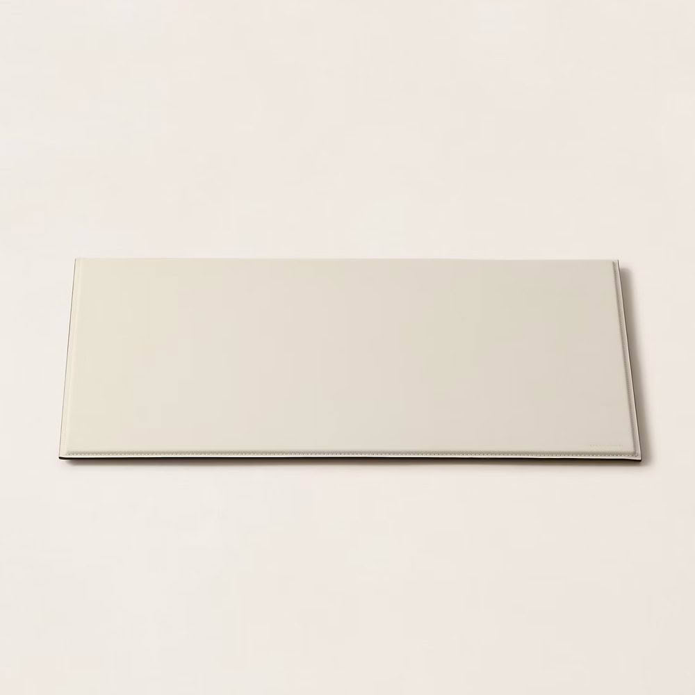Rectangular beige ceramic tile on white background