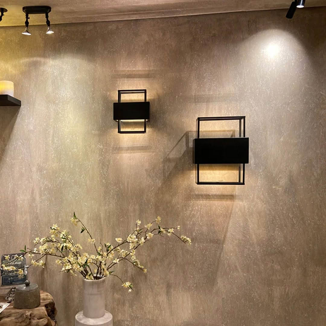 Wall-mounted square lamps and vase with flowers