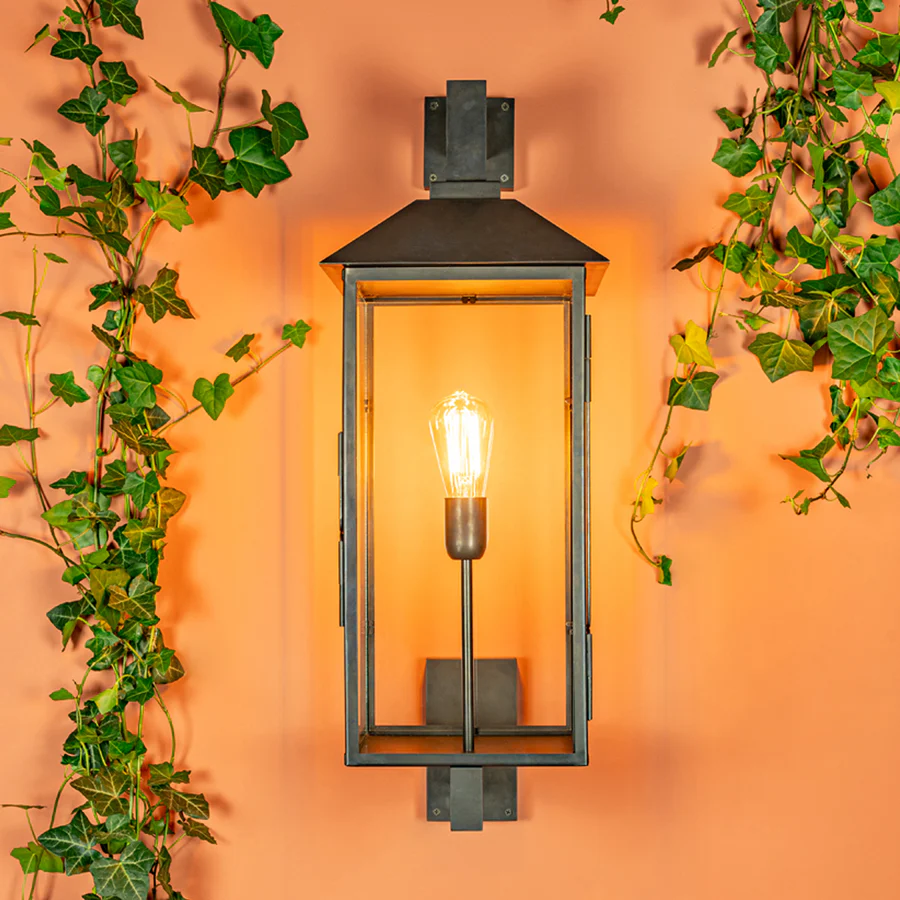 Wall-mounted lantern with ivy on orange background